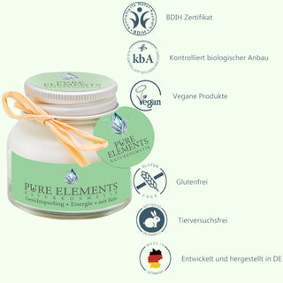Gesichtspeeling Energie mit Reis von Pure Elements auf der linken Seite des Bildes. Rechts daneben sind sechs Piktogramme mit Logos und Beschreibungen: BDIH-zertifiziert, kontrolliert biologischer Anbau, vegane Produkte, glutenfrei, tierversuchsfrei und entwickelt sowie hergestellt in Deutschland. Natürliches Peeling mit Reiskörnern, Vitamin E, Avocadoöl und echten Bergkristallen.