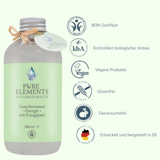 Das Gesichtswasser •Energie• mit Frangipani in der 200 ml Flasche steht auf der linken Seite. Rechts daneben befinden sich sechs Piktogramme mit den Eigenschaften: BDIH-zertifiziert, kontrolliert biologischer Anbau, vegane Produkte, glutenfrei, tierversuchsfrei, entwickelt und hergestellt in Deutschland.